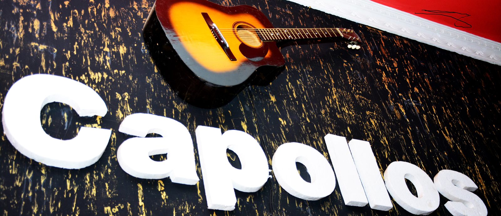 Capollos signage installation by Canopy Interiors